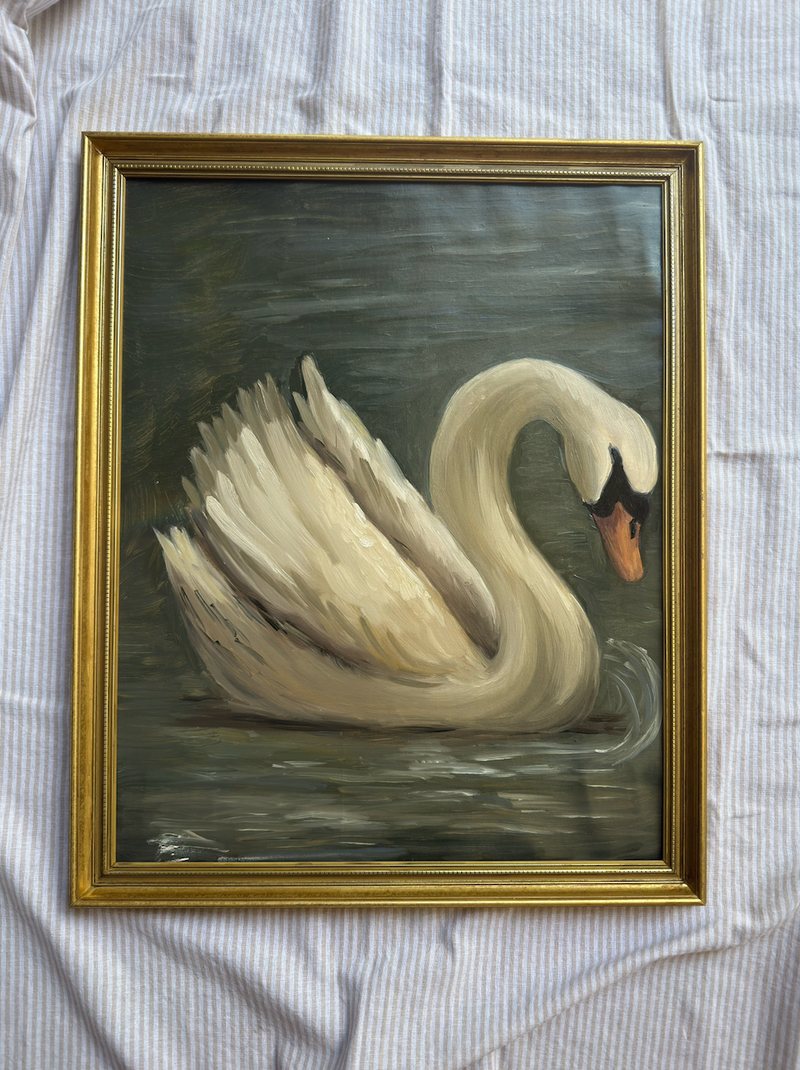 Framed painting of a swan on a textured fabric background